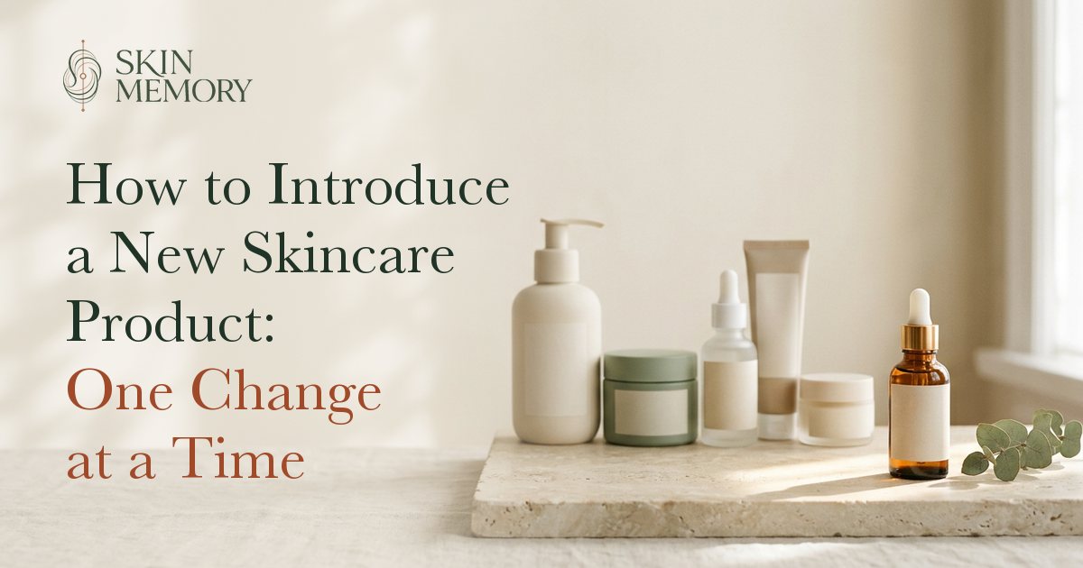 A single new serum bottle set apart from a row of familiar skincare products, illustrating introducing one skincare product at a time